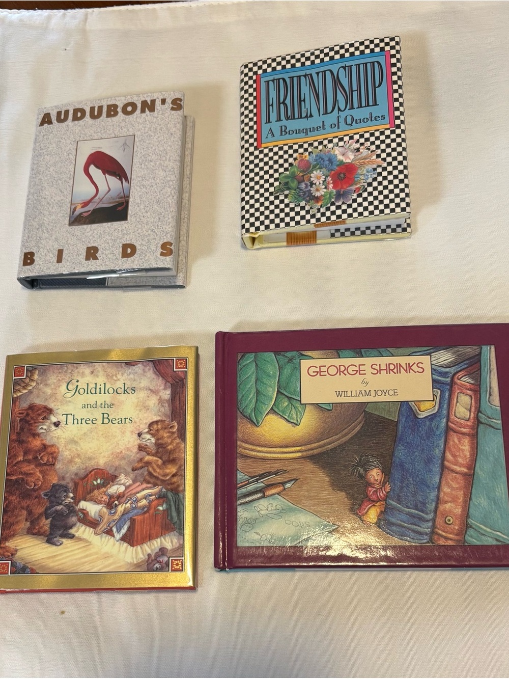 4 miniature books.
